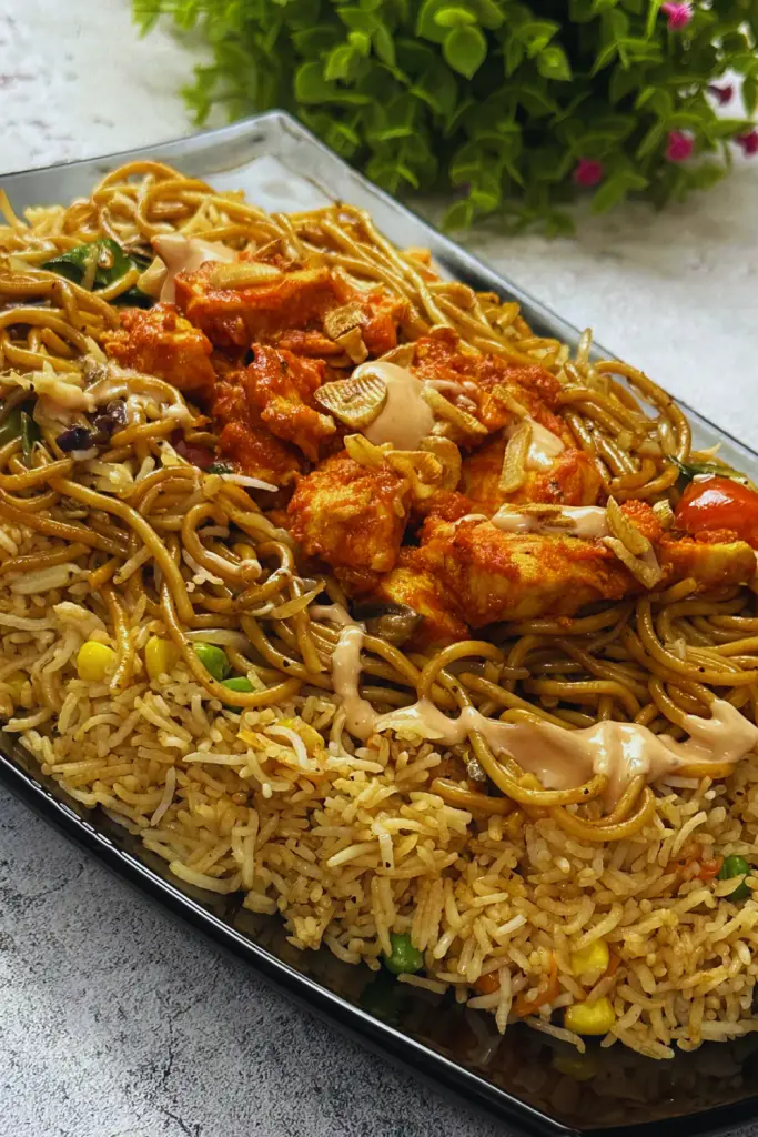 Delicious Singaporean Rice Recipe: How to Make in 20 Minutes 7 Make delicious Singaporean Rice in just 20 minutes! A perfect mix of noodles, rice, spicy chicken, and creamy sauce—easy, quick, and full of flavour for weeknight dinners.